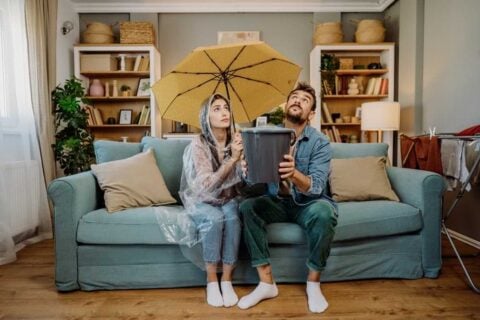 A couple dealing with roof leakage of their home in NC & SC area